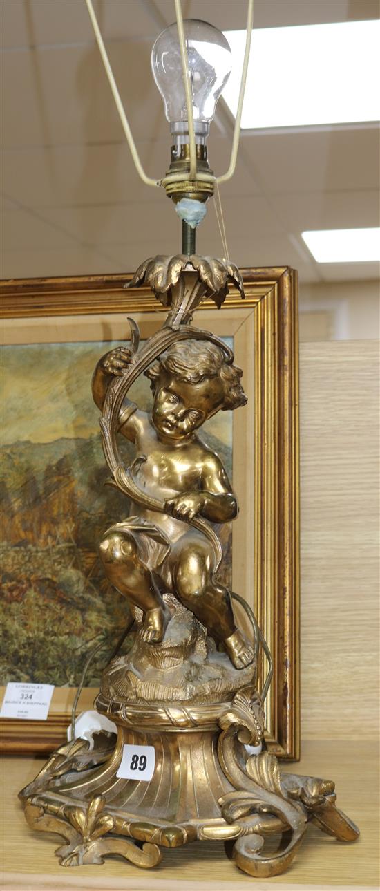 A 19th century French bronze table lamp, modelled as a putto 38cm